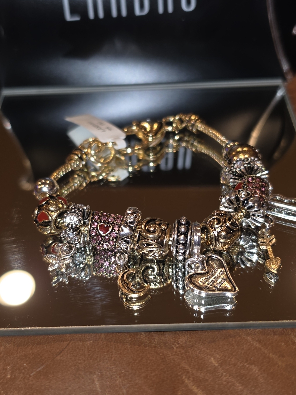 Landau Gold-Tone Charm Bracelet with Pink Accents